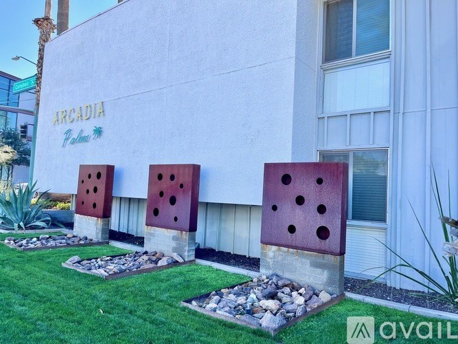 A white building with the word Arcadia painted on it.