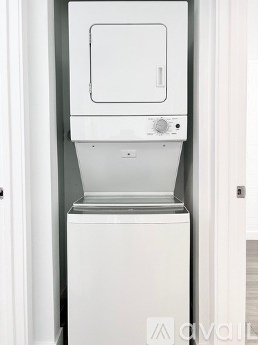 A white dishwasher is installed in a kitchen.