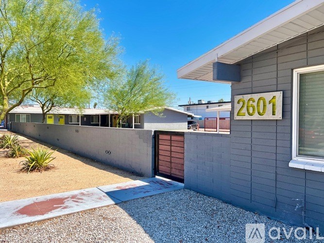 A house numbered 2601 with a brown garage door.