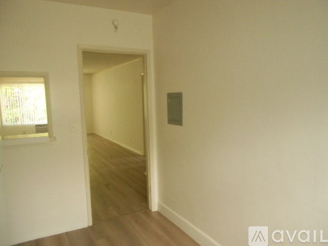 A room with a doorway leading to another room.