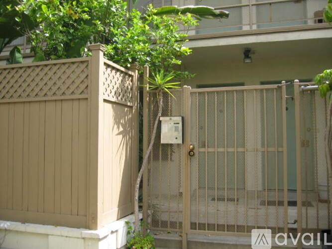 A gate with a lock and a sign on it.
