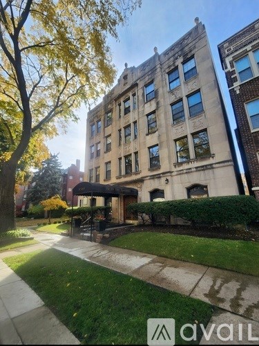 A large building with a tree in front of it.