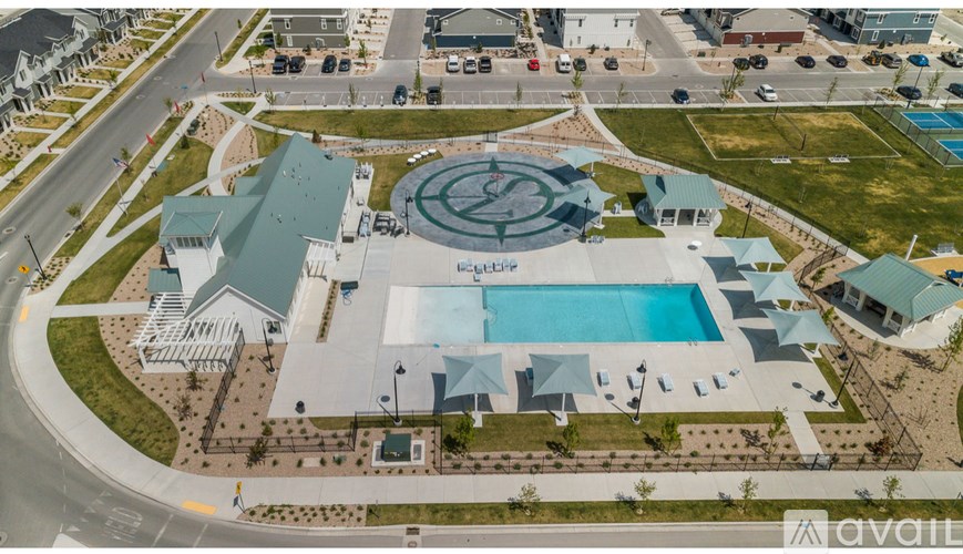 An aerial view of a swimming pool surrounded by buildings.