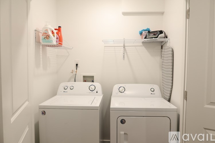 A bathroom with two sinks and a toilet.