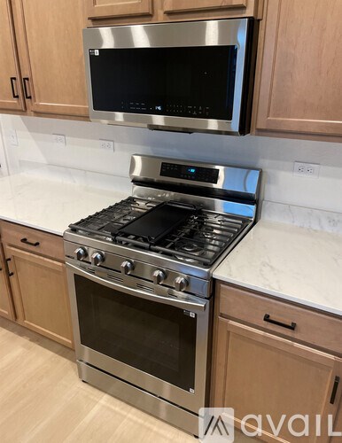 A modern kitchen with a stainless steel stove and oven.