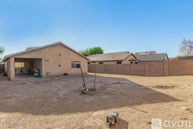 A house with a brown roof and a concrete foundation is shown in the image.
