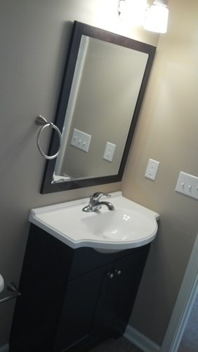A bathroom sink with a mirror above it.