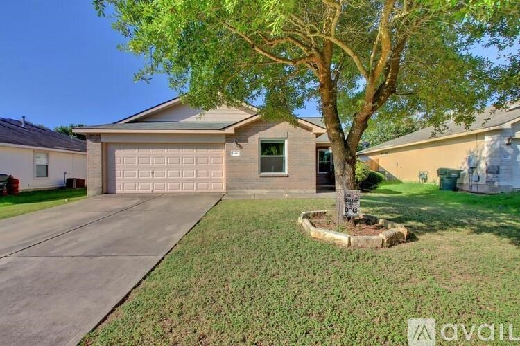 A house with a tree in front of it.