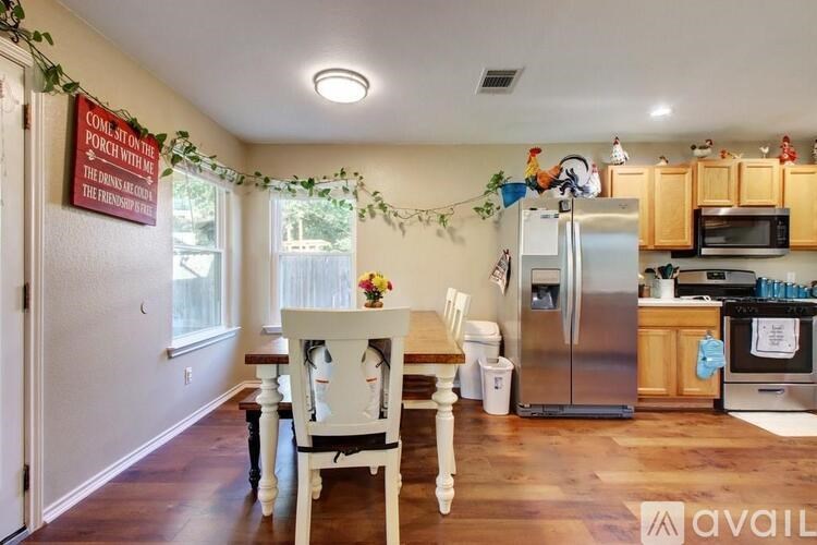 A kitchen with a sign on the door that says "Do not enter the porch without the key.".