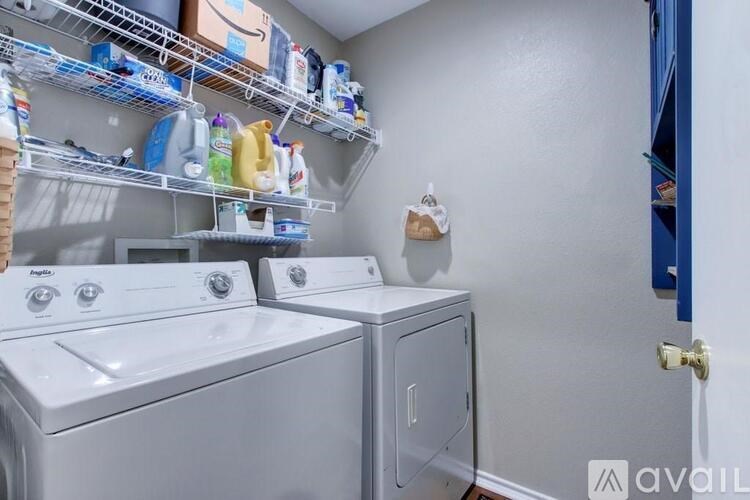 A laundry room with a washer and dryer.
