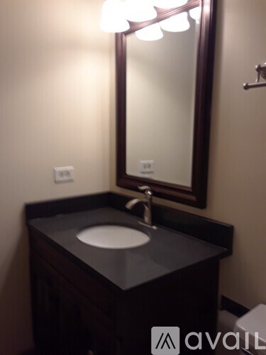 A bathroom sink with a mirror above it.