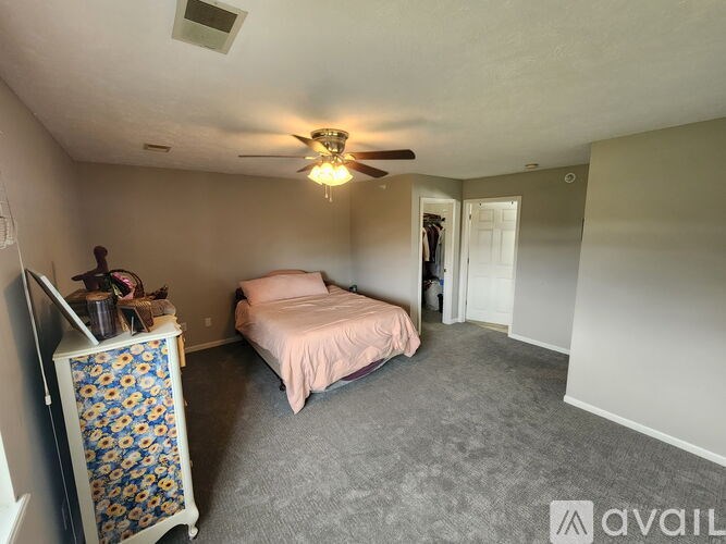 A floor plan of a house with a living room, dining area, kitchen, laundry, and multiple bedrooms.