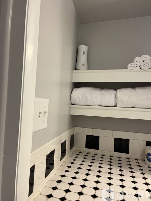 A white and black checkered floor in a bathroom.