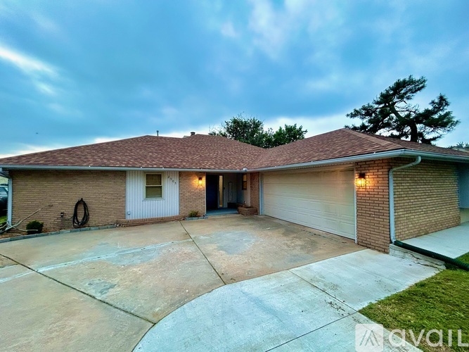 A house with a garage and a driveway.