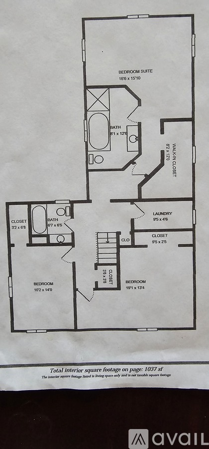 A floor plan of an apartment with a bedroom suite, bathroom, laundry, and closet.