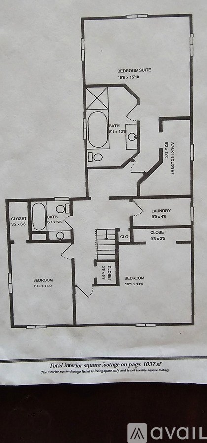 A floor plan of an apartment with a bedroom suite, bathroom, laundry, and closet.