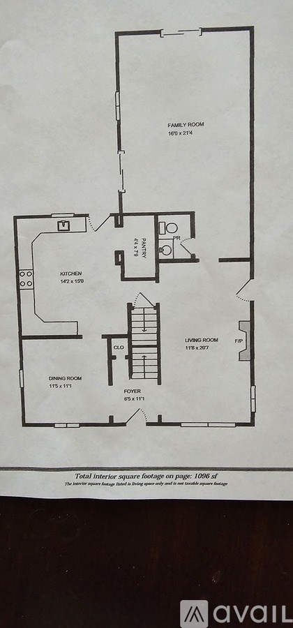 A floor plan of a house with a living room, dining room, kitchen, and two bathrooms.
