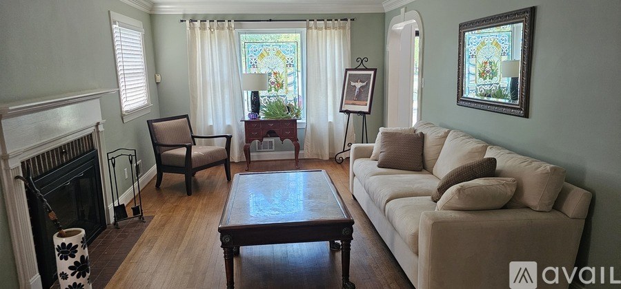 A living room with a fireplace and a couch.