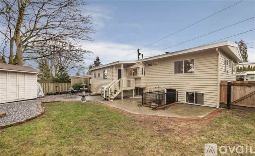 A house with a backyard and a fence.