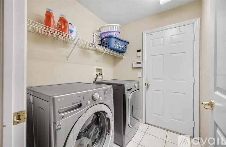 A laundry room with a washer and dryer.