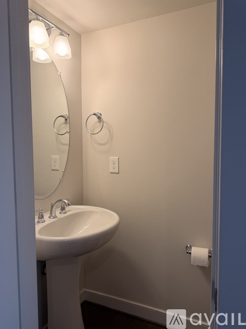 A bathroom with a sink and mirror.