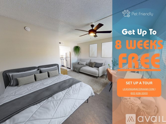 A room with a bed, couch, and chair is on display for a move in special offer.