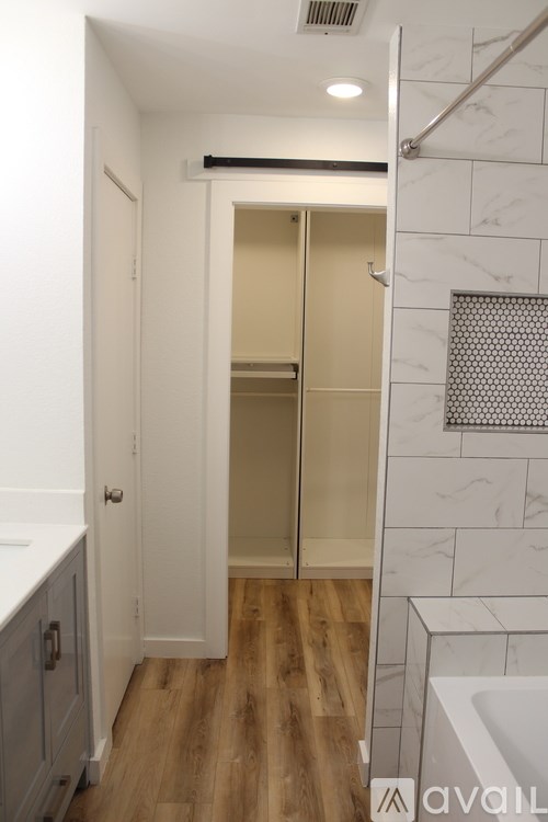A bathroom with a walk-in shower and a toilet.