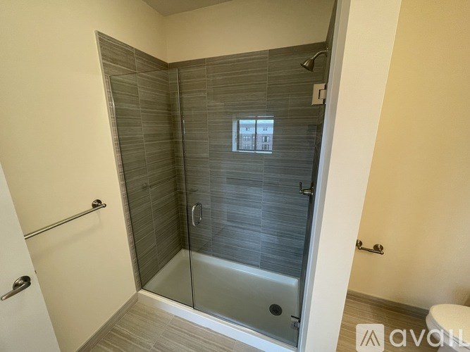 A modern bathroom with a walk-in shower.