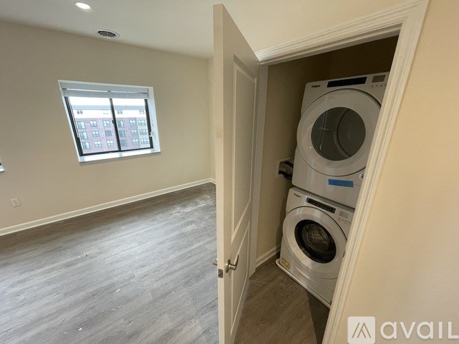 A laundry room with a washer and dryer in it.
