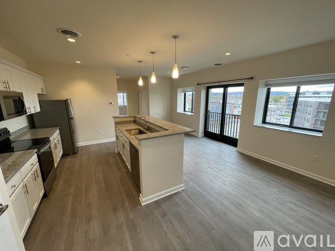 A spacious kitchen with a large island in the middle.