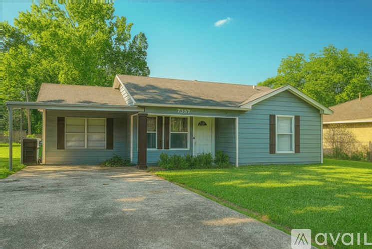A house with a driveway in front of it.