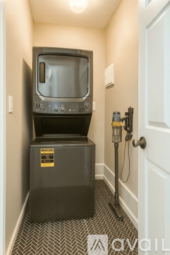 A black television set with a yellow sticker on the front of the cabinet.