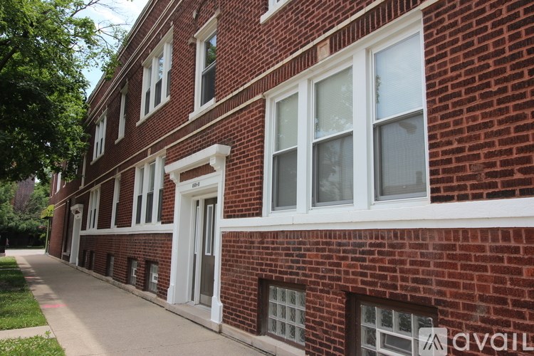 A red brick building with white trim and windows.