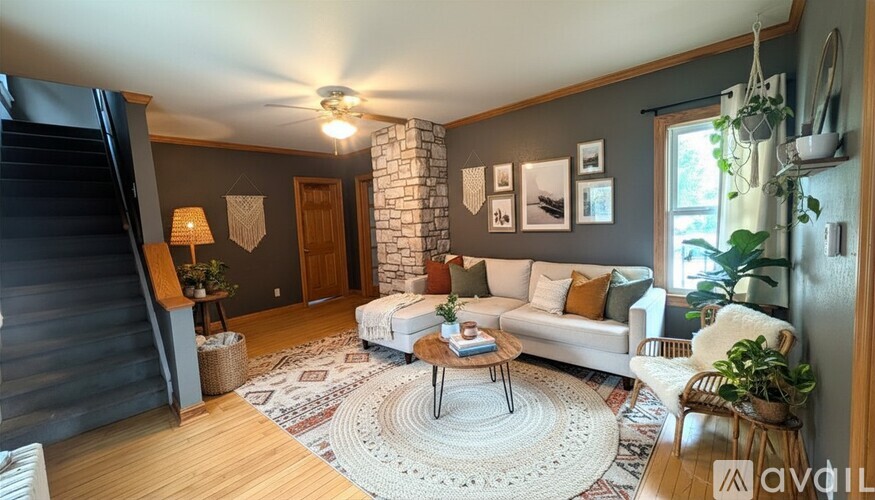 A room with a slanted ceiling and a white door.