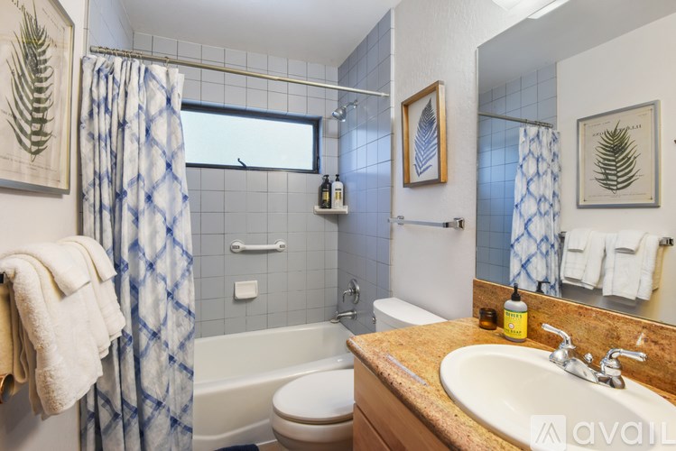 A bathroom with a towel hanging on the wall.