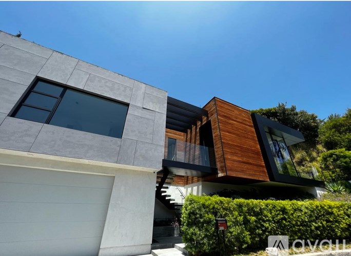 A modern house with a white garage door.
