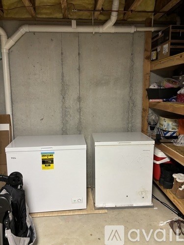 Two white VCL units in a basement.