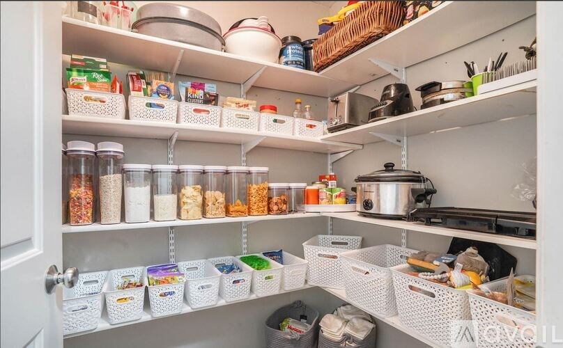 A well-organized pantry with various food items and containers.