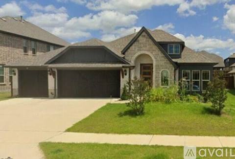 A house with a driveway in front of it.