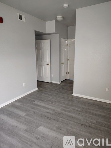 A room with a grey floor and white walls.
