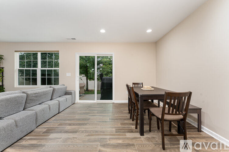 A dining room with a table set for four.