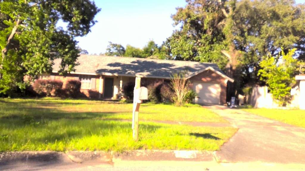 A house with a mailbox in front of it.