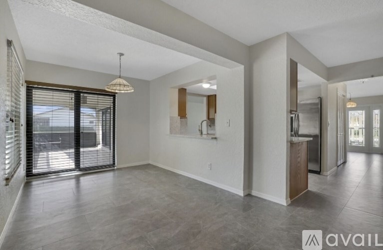 A bathroom with a sink, toilet, and mirror.