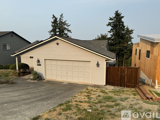 A house with a garage is available for sale.