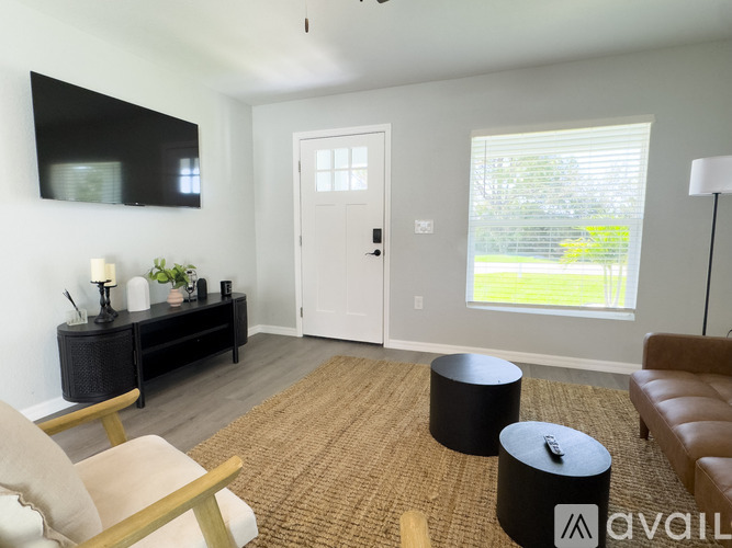 A modern kitchen with a dining table and chairs.