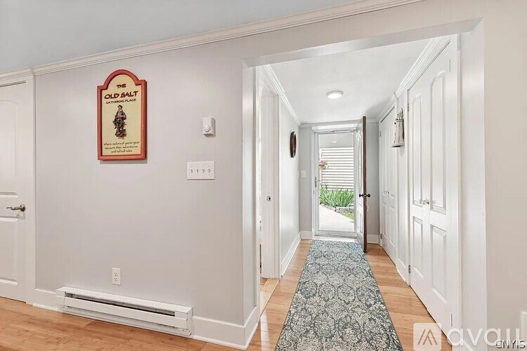 A hallway with a sign that says "The Old Salt".