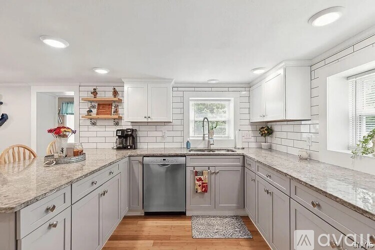 A kitchen with a dishwasher and a sink.