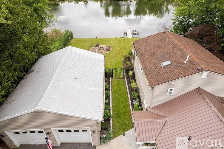 A house with a garage and a flag on it.