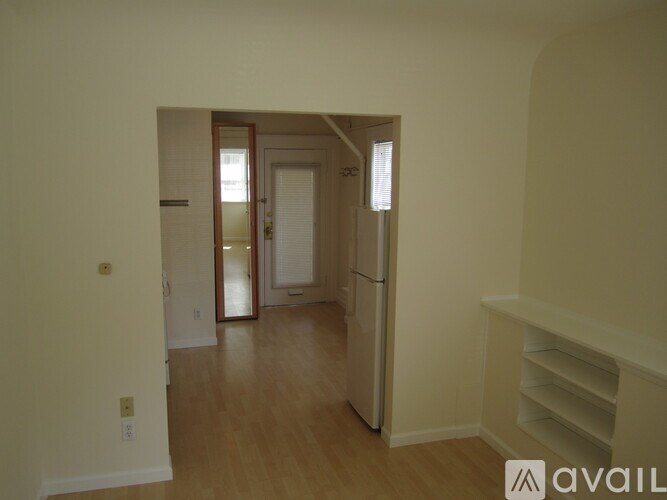 A room with a door and a window.