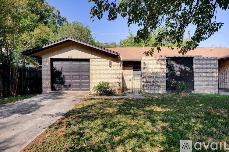 A house with a garage is for sale.
